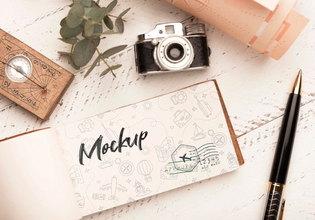 Top View Of Paper With Compass And Camera For Traveling Psd