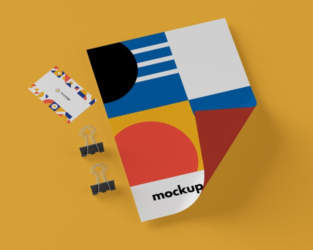 Top View Of Paper With Multicolored Shapes And Paper Clips Psd