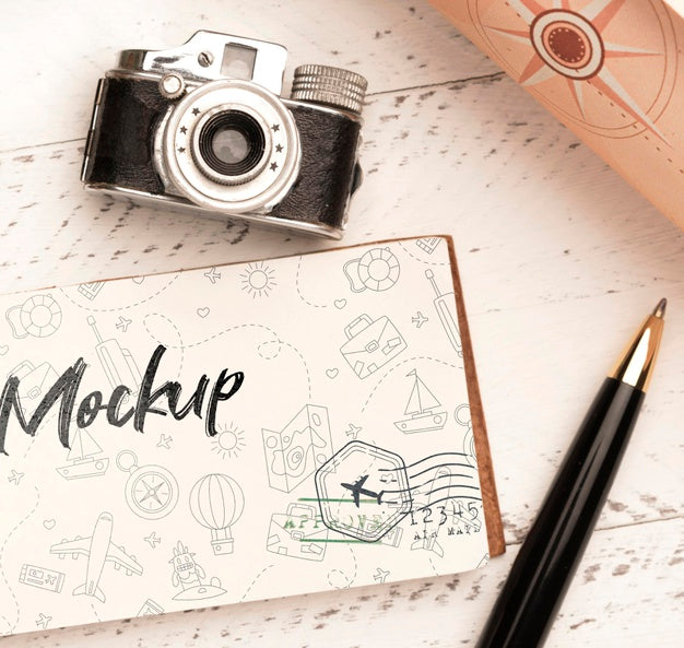 Top View Of Paper With Pen And Camera For Traveling Psd