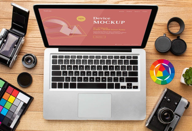 Top View Of Photographer Wooden Workspace With Laptop Psd