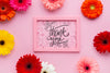 Top View Of Pink Frame Mock-Up With Flowers Psd