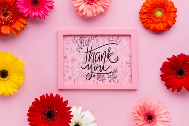 Top View Of Pink Frame Mock-Up With Flowers Psd