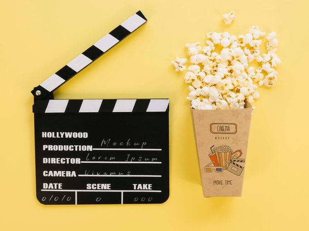 Top View Of Popcorn Cup With Clapperboard Psd