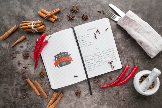 Top View Of Recipe Book With Cutlery And Chili Peppers Psd