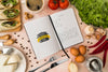 Top View Of Recipe Book With Ingredients And Cheese Psd