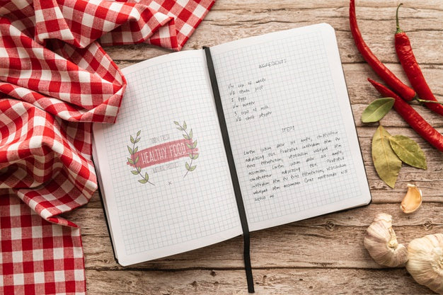 Top View Of Recipe With Tablecloth And Chili Peppers Psd