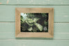 Top View Of Rectangular Frame On Wooden Background Psd