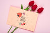 Top View Of Red Tulips And Card Psd