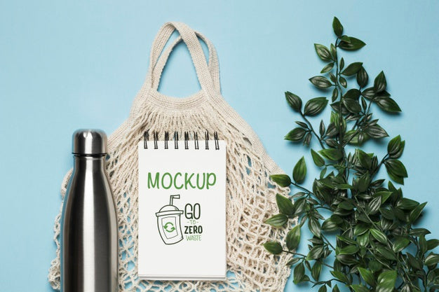 Top View Of Reusable Bag With Plant And Bottle Psd