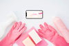 Top View Of Smartphone And Cleaning Gloves Psd