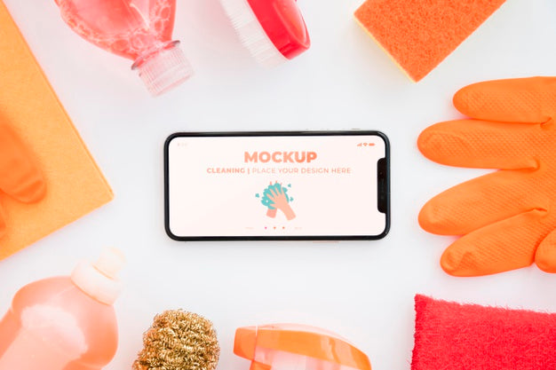 Top View Of Smartphone With Cleaning Products And Gloves Psd
