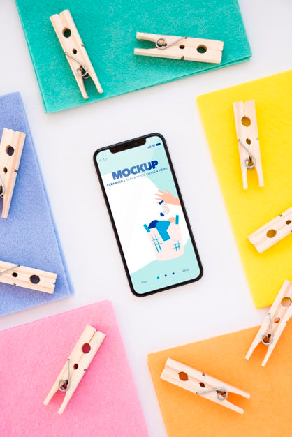 Top View Of Smartphone With Clothing Pins Psd