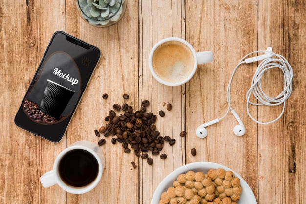 Top View Of Smartphone With Coffee Beans And Cup Of Tea Psd