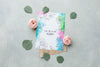 Top View Of Spring Roses With Card And Leaves Psd