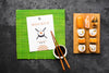 Top View Of Sushi On Chopping Board With Chopsticks And Soy Sauce Psd