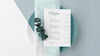 Top View Of Table Arrangement With Spring Menu Mock-Up And Leaves Psd