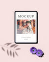 Top View Of Tablet With Photo And Flowers Psd