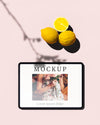 Top View Of Tablet With Photo And Lemons Psd