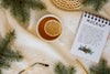 Top View Of Tea With Spruce Branches And Notebook Psd
