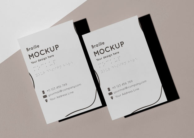 Top View Of Two Business Cards With Embossed Braille Psd