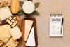 Top View Of Variety Of Cheese With Notebook And Pen Psd