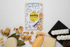 Top View Of Variety Of Cheese With Notepad And Walnuts Psd