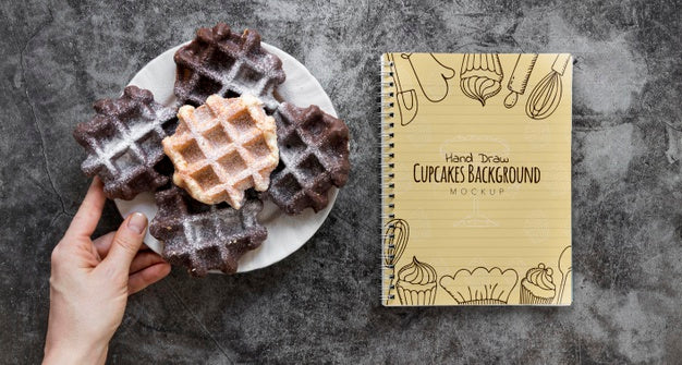 Top View Of Waffles On Plate With Notebook Psd