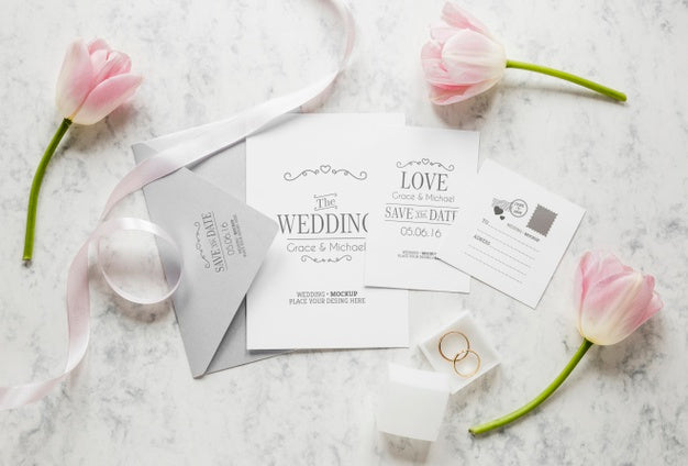 Top View Of Wedding Cards With Envelope And Flowers Psd