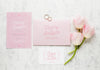 Top View Of Wedding Cards With Rings And Flowers Psd
