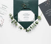 Top View Of Wedding Cards With Rings And Plants Psd
