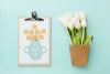 Top View Of White Tulips And Notepad Psd