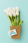 Top View Of White Tulips With Card Psd