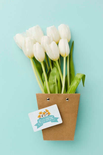 Top View Of White Tulips With Card Psd