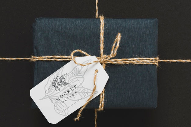 Top View Of Wrapped Present With Tag Psd