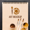 Top View Painting Brushes On Notebook Psd