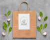 Top View Paper Bag Mock-Up And Leaves Psd