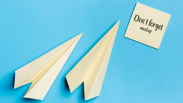 Top View Paper Plane And Sticky Note With Mock-Up Psd