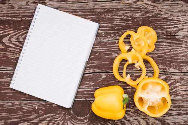 Top View Peppers With Notebook Psd