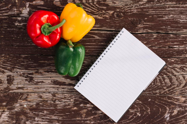 Top View Peppers With Notebook Psd