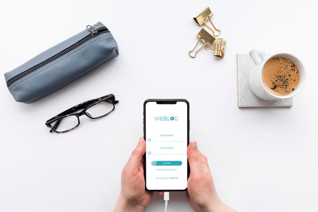 Top View Person With Mock-Up Phone At Desk Psd