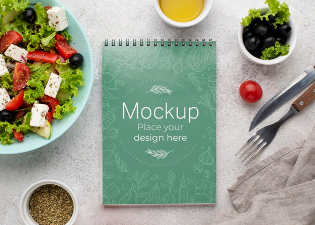 Top View Salad And Notebook Arrangement Psd