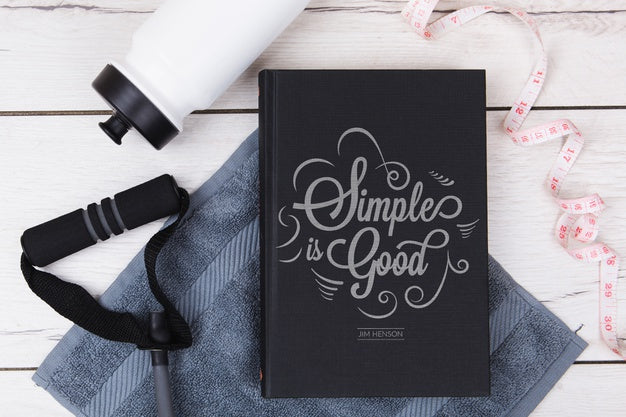 Top View Simple Is Good Quote Book With Fitness Accessories Psd