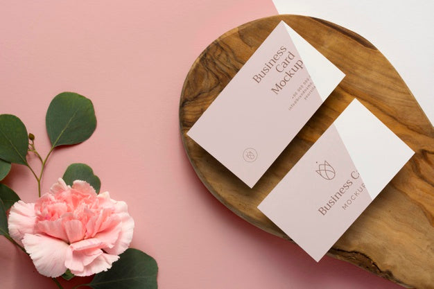 Top View Stationery On Wood With Flowers Psd