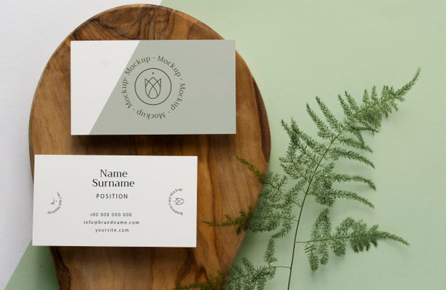 Top View Stationery On Wood With Plant Psd