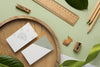 Top View Stationery With Wood And Plant Psd