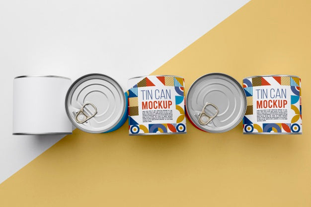 Top View Tin Cans Arranged On Table Psd