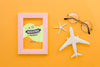 Top View Travelling Plane With Glasses And Frame Psd