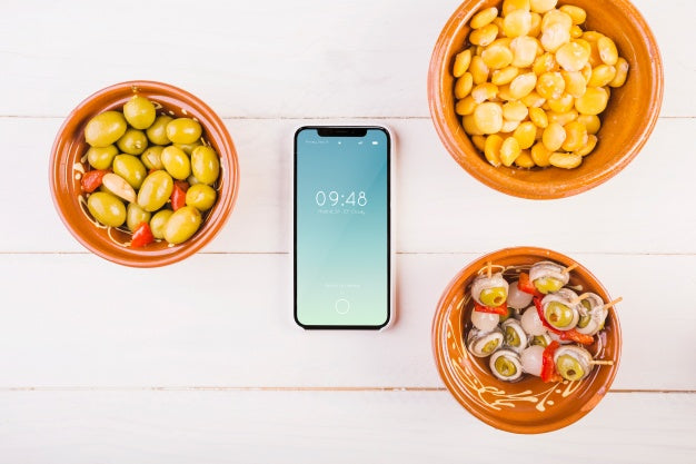 Traditional Spanish Food Mockup With Smartphone Psd