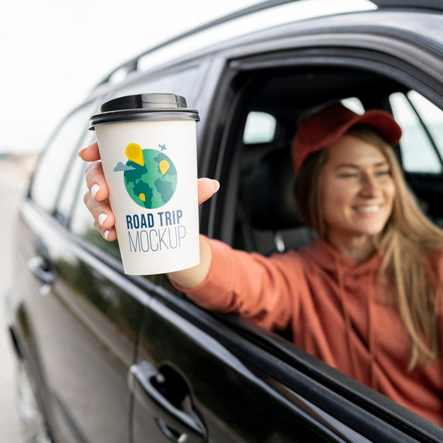 Traveler Holding A Mock-Up Cup Of Coffee Psd