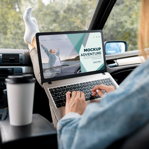 Traveler Holding A Mock-Up Laptop Psd